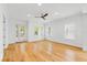 Bright living room featuring hardwood floors, multiple windows, and glass door access at 1746 Stapleton St, Sarasota, FL 34239