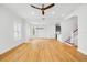 Spacious living room with hardwood floors, white walls, and staircase access at 1746 Stapleton St, Sarasota, FL 34239