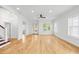 Expansive living room with hardwood floors, multiple windows, and glass door access at 1746 Stapleton St, Sarasota, FL 34239