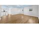 Spacious loft area with hardwood floors, bright lighting, and versatile space for various activities at 1746 Stapleton St, Sarasota, FL 34239