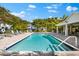 Community pool with lounge chairs and shade, great for relaxation and recreation at 1746 Stapleton St, Sarasota, FL 34239