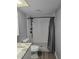 Bathroom featuring modern fixtures and a sleek shower-tub combination at 2566 Forest Run Ct, Clearwater, FL 33761