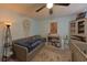 Comfortable bedroom with ceiling fan, daybed, and charming decor at 2566 Forest Run Ct, Clearwater, FL 33761
