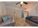 Inviting bedroom featuring a crib, daybed, and washer/dryer access at 2566 Forest Run Ct, Clearwater, FL 33761
