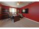 Spacious office featuring a large desk, comfortable seating, and natural light at 2566 Forest Run Ct, Clearwater, FL 33761