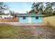 A quaint home with a fenced yard and patio, providing privacy and outdoor space at 3200 Tobero Ln, Sarasota, FL 34235