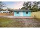 A quaint home with a fenced yard and patio, providing privacy and outdoor space at 3200 Tobero Ln, Sarasota, FL 34235