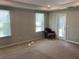 A spacious carpeted bedroom with neutral walls and recessed lighting at 4432 Collingswood Blvd, Port Charlotte, FL 33948