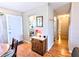Hallway with hardwood floors leading to the kitchen and other rooms at 5918 Palm Ln # C33, Bradenton, FL 34207