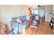 Open living area with laminate wood floor, sofa, wooden furniture, and decor at 5918 Palm Ln # C33, Bradenton, FL 34207
