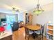 Cozy living space with dining area, ceiling fan, light fixture, and sliding glass doors to the outside at 5918 Palm Ln # C33, Bradenton, FL 34207
