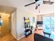 Cozy living room with hardwood floors and sliding glass doors to the balcony at 5918 Palm Ln # C33, Bradenton, FL 34207