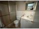 Bathroom featuring a shower, toilet, sink and vanity at 600 S Neponsit Dr, Venice, FL 34293