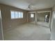 Bedroom featuring two mirrored closets, a window and a ceiling fan at 600 S Neponsit Dr, Venice, FL 34293
