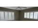 Bedroom featuring white window shutters and ceiling fan at 600 S Neponsit Dr, Venice, FL 34293