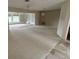 Expansive living room featuring lots of natural light and adjoining rooms at 600 S Neponsit Dr, Venice, FL 34293
