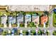 Aerial view of houses featuring pools, beautiful lawns, mature landscaping, and neighborhood streets at 7453 Featherstone Blvd, Sarasota, FL 34238