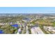 Gorgeous aerial perspective of the community highlighting the lake views, surrounding trees, and colorful neighborhood houses at 7453 Featherstone Blvd, Sarasota, FL 34238
