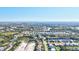 Breathtaking aerial view of the community, highlighting the surrounding lakes, tree lined streets, and neighborhood homes at 7453 Featherstone Blvd, Sarasota, FL 34238