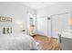 Bright bedroom with wood floors, and ample closet space at 7453 Featherstone Blvd, Sarasota, FL 34238