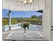 Breakfast nook view overlooking the pool and lush landscaping at 7453 Featherstone Blvd, Sarasota, FL 34238