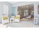 Inviting outdoor patio with seating area, perfect for relaxing and entertaining near the indoor living space at 7453 Featherstone Blvd, Sarasota, FL 34238