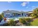 Expansive backyard featuring a pristine pool, well-maintained landscaping, and gazebo at 7453 Featherstone Blvd, Sarasota, FL 34238