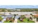 Charming single-story home featuring a manicured lawn, palm trees, with other houses across the street at 7453 Featherstone Blvd, Sarasota, FL 34238