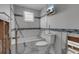 Renovated bathroom with a bath, toilet and a television at 765 Saint Judes N Dr, Longboat Key, FL 34228