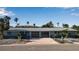 Charming single-story home featuring a two-car garage and a beautifully paved driveway at 765 Saint Judes N Dr, Longboat Key, FL 34228