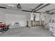 Spacious two-car garage with drywall removed due to water damage at 765 Saint Judes N Dr, Longboat Key, FL 34228