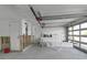 Spacious garage with overhead door and new water heater, ready for customizing at 765 Saint Judes N Dr, Longboat Key, FL 34228