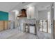 A partially finished kitchen with white cabinets, copper accents, and an island at 765 Saint Judes N Dr, Longboat Key, FL 34228