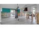 A large unfinished kitchen with white cabinets, a copper range hood, and a view of the pool outside at 765 Saint Judes N Dr, Longboat Key, FL 34228
