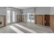 Bright living room featuring wood-look flooring and windows and patio doors at 765 Saint Judes N Dr, Longboat Key, FL 34228