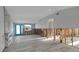 Spacious living room with turquoise door and modern fireplace, ready for renovation and personalization at 765 Saint Judes N Dr, Longboat Key, FL 34228