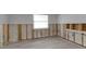 Bright living room featuring wood-look flooring and a window at 765 Saint Judes N Dr, Longboat Key, FL 34228