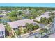 Aerial view of townhomes and landscaping, showing a community with pond views and well-kept grounds at 1605 Napoli W Dr, Sarasota, FL 34232