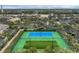 Top-down view of tennis courts with a pickleball court and manicured surroundings at 1605 Napoli W Dr, Sarasota, FL 34232