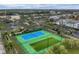 Aerial view of tennis and pickleball courts surrounded by manicured landscaping at 1605 Napoli W Dr, Sarasota, FL 34232