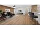 Bright living room featuring modern decor, wood-look floors, sleek furniture, and a stylish accent wall at 2321 Beneva Ter # 2288, Sarasota, FL 34232