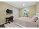 Cozy bedroom with a dark wood floor, closet, window and a desk for a comfortable living space at 2500 Jamaica St, Sarasota, FL 34231