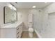 Bright bathroom with marble countertop, and walk-in shower at 362 Pine Run Dr, Osprey, FL 34229