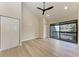 Bright bedroom with wood floor and sliding door to patio at 362 Pine Run Dr, Osprey, FL 34229