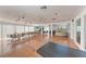 Spacious common area featuring hardwood floors, plenty of seating and natural light at 362 Pine Run Dr, Osprey, FL 34229