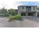 Condo building featuring muted color, parking below units, and native landscaping at 362 Pine Run Dr, Osprey, FL 34229
