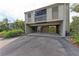 A exterior shot of the condo showing the parking area and muted exterior at 362 Pine Run Dr, Osprey, FL 34229