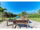 Community firepit seating area with pond view at 362 Pine Run Dr, Osprey, FL 34229