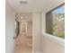 Hallway with natural light and wood floors at 362 Pine Run Dr, Osprey, FL 34229