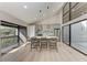 Modern kitchen featuring an island with bar seating and stainless appliances at 362 Pine Run Dr, Osprey, FL 34229